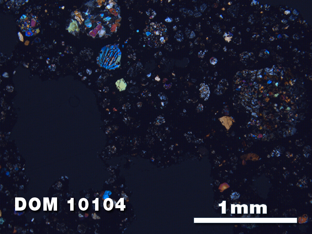 Thin Section Photo of Sample DOM 10104 at 2.5X Magnification in Cross-Polarized Light
