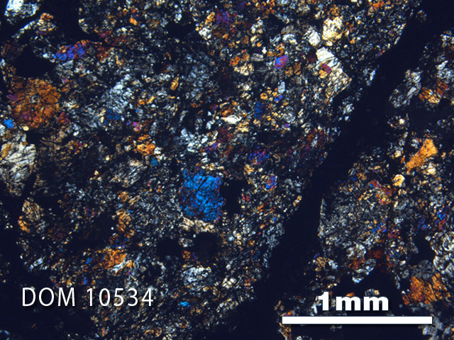 Thin Section Photo of Sample DOM 10534 in Cross-Polarized Light with 2.5X Magnification