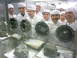 Students from CCISD, part of Space Center Houston's Lunar Growth program, tour the Lunar Sample Lab escorted by Charlie Galindo (HEI), far back right.