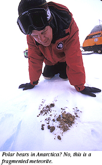 ANSMET 2002-2003 season - Carl Allen looking at dirt