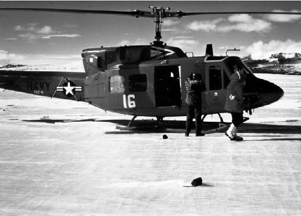 Figure 15. High altitude helicopter with three meteorites on blue ice collected during 1978 joint American-Japanese expedition to Allan Hills.