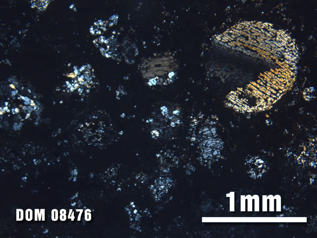 Thin Section Photo of Sample DOM 08476 at 2.5X Magnification in Cross-Polarized Light