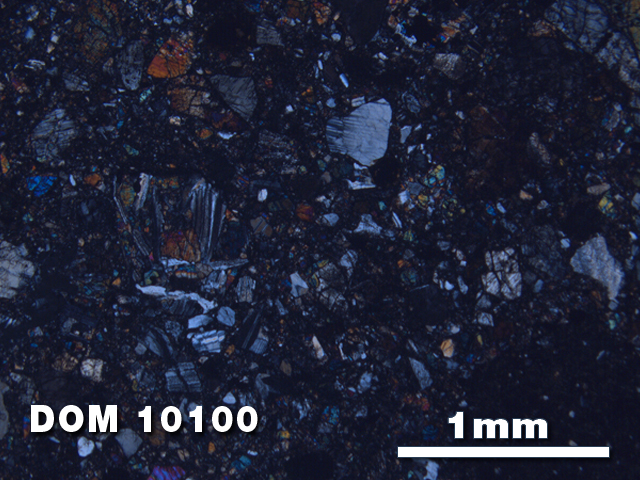 Thin Section Photo of Sample DOM 10100 at 2.5X Magnification in Cross-Polarized Light