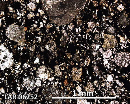LAR 06252 Meteorite Thin Section Photo with 5x magnification in Plane-Polarized Light