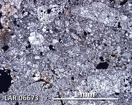 LAR 06673 Meteorite Thin Section Photo with 5x magnification in Plane-Polarized Light