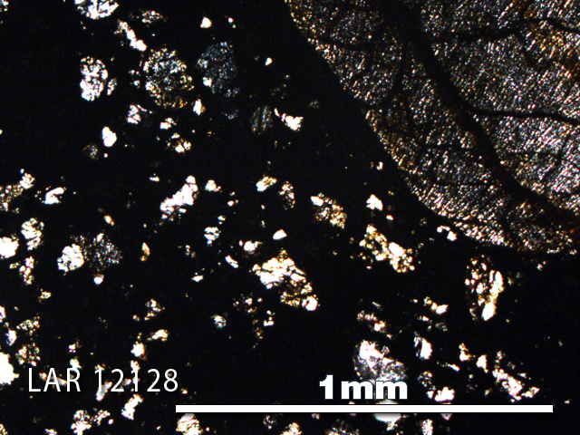 Thin Section Photo of Sample LAR 12128 in Plane-Polarized Light with 5X Magnification