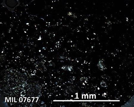 MIL 07677 Meteorite Thin Section Photo with 5x magnification in Cross-Polarized Light