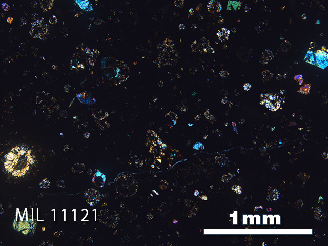 Thin Section Photo of Sample MIL 11121 in Cross-Polarized Light with 2.5x Magnification