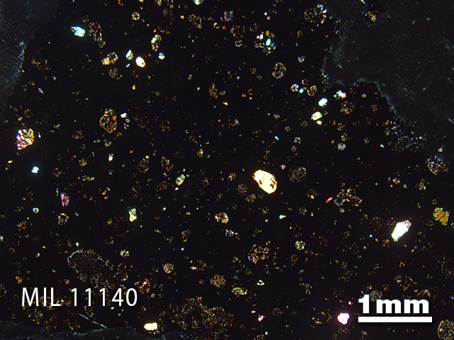 Thin Section Photo of Sample MIL 11140 in Cross-Polarized Light with 1.25x Magnification