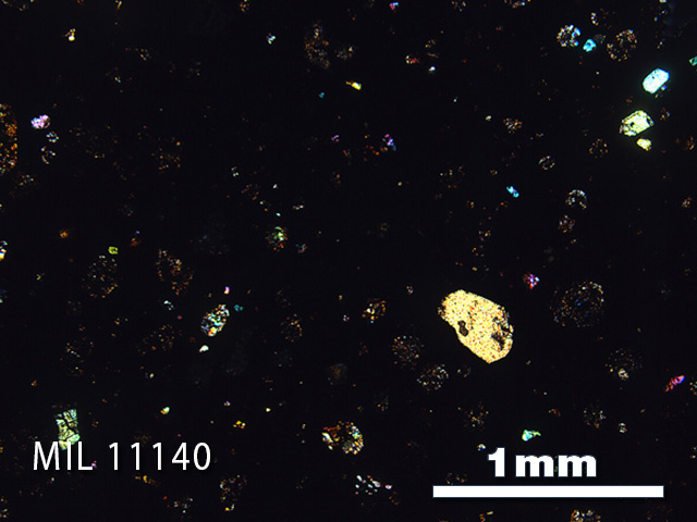 Thin Section Photo of Sample MIL 11140 in Cross-Polarized Light with 2.5x Magnification