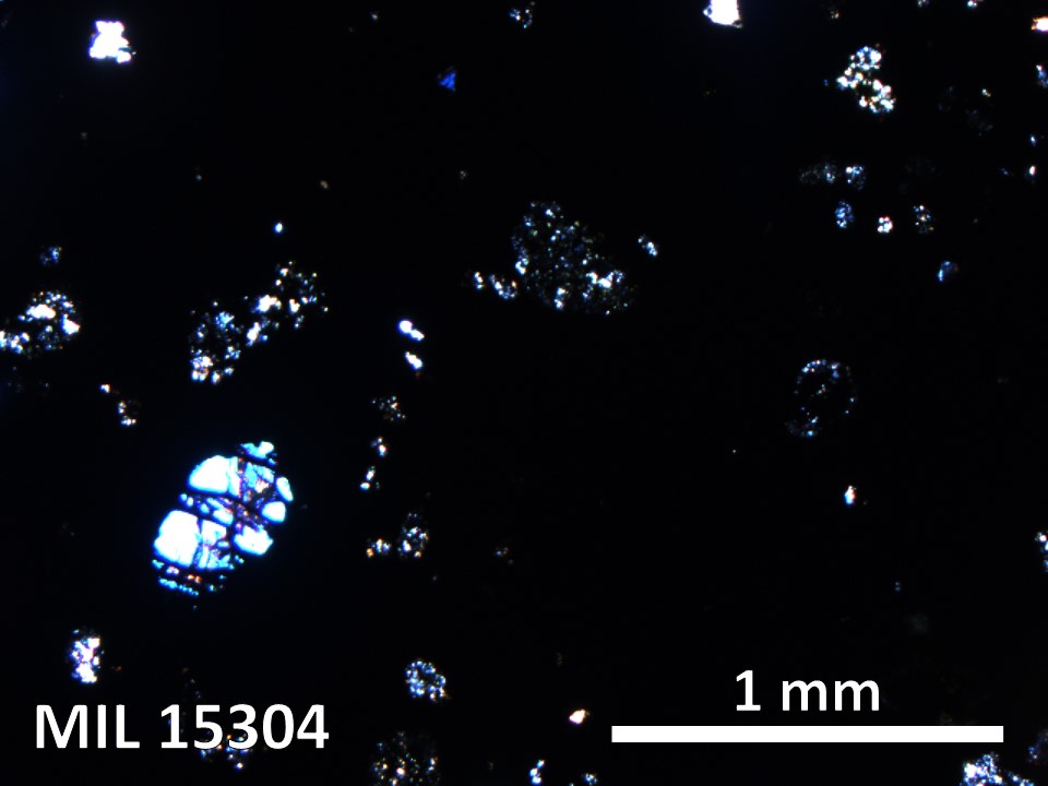 Thin Section Photo of Sample MIL 15304 in Cross-Polarized Light with 5X Magnification