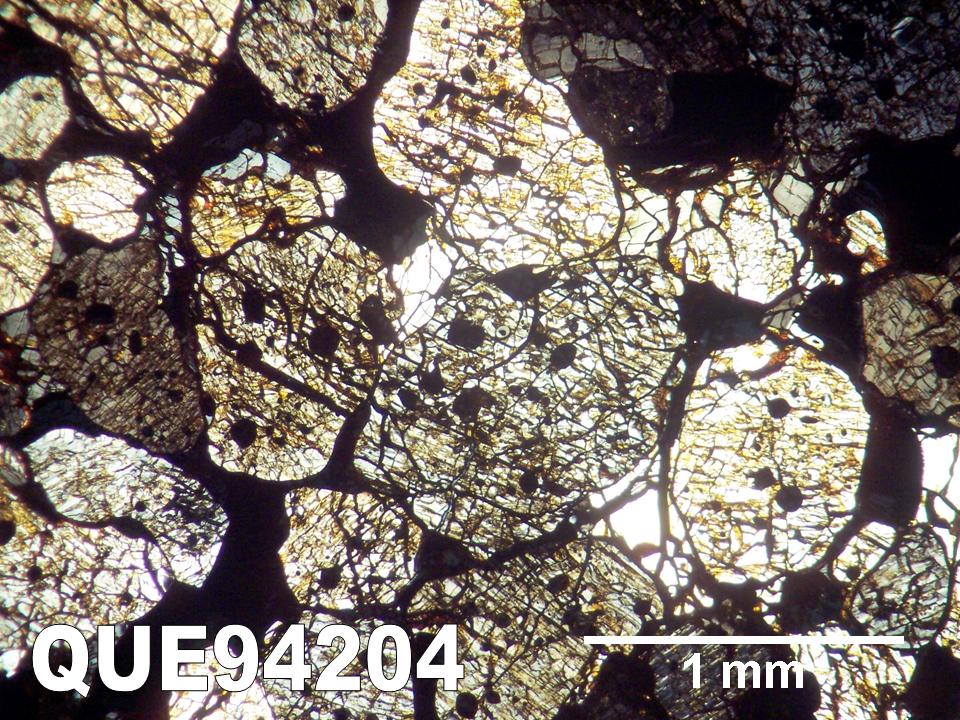 Thin Section Photo of Sample QUE 94204 in Cross-Polarized Light