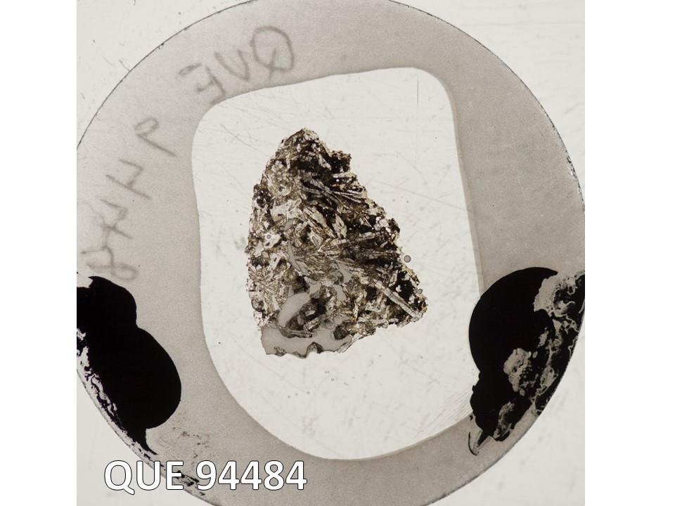 Thin Section Photo of Sample QUE 94484 in Plane-Polarized Light with 2.5X Magnification
