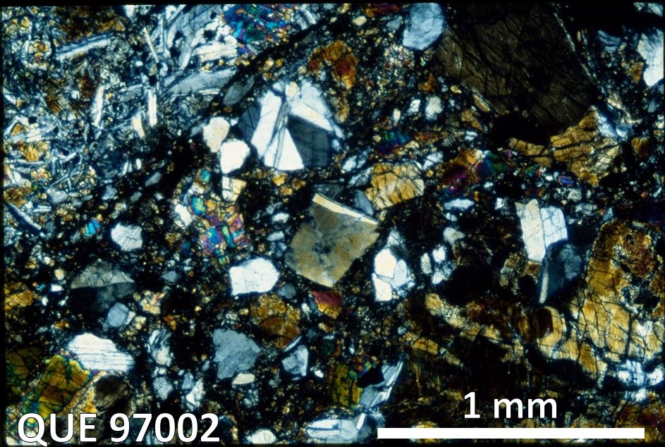 Thin Section Photo of Sample QUE 97002 in Cross-Polarized Light with 2.5X Magnification