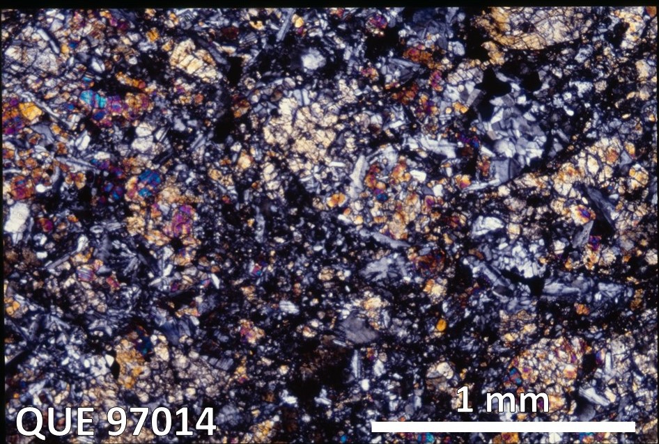 Thin Section Photo of Sample QUE 97014 in Cross-Polarized Light with 2.5X Magnification