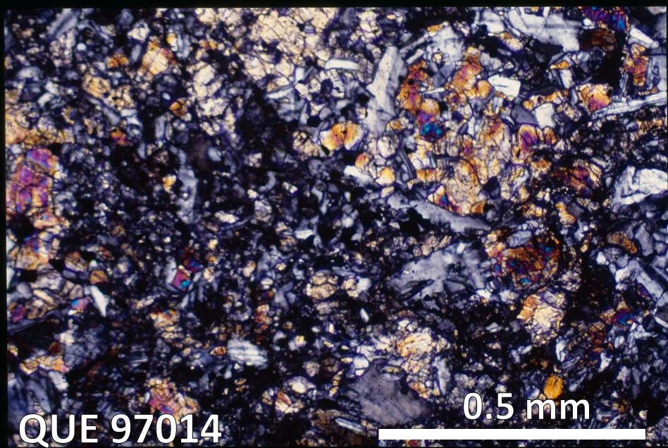 Thin Section Photo of Sample QUE 97014 in Cross-Polarized Light with 5X Magnification