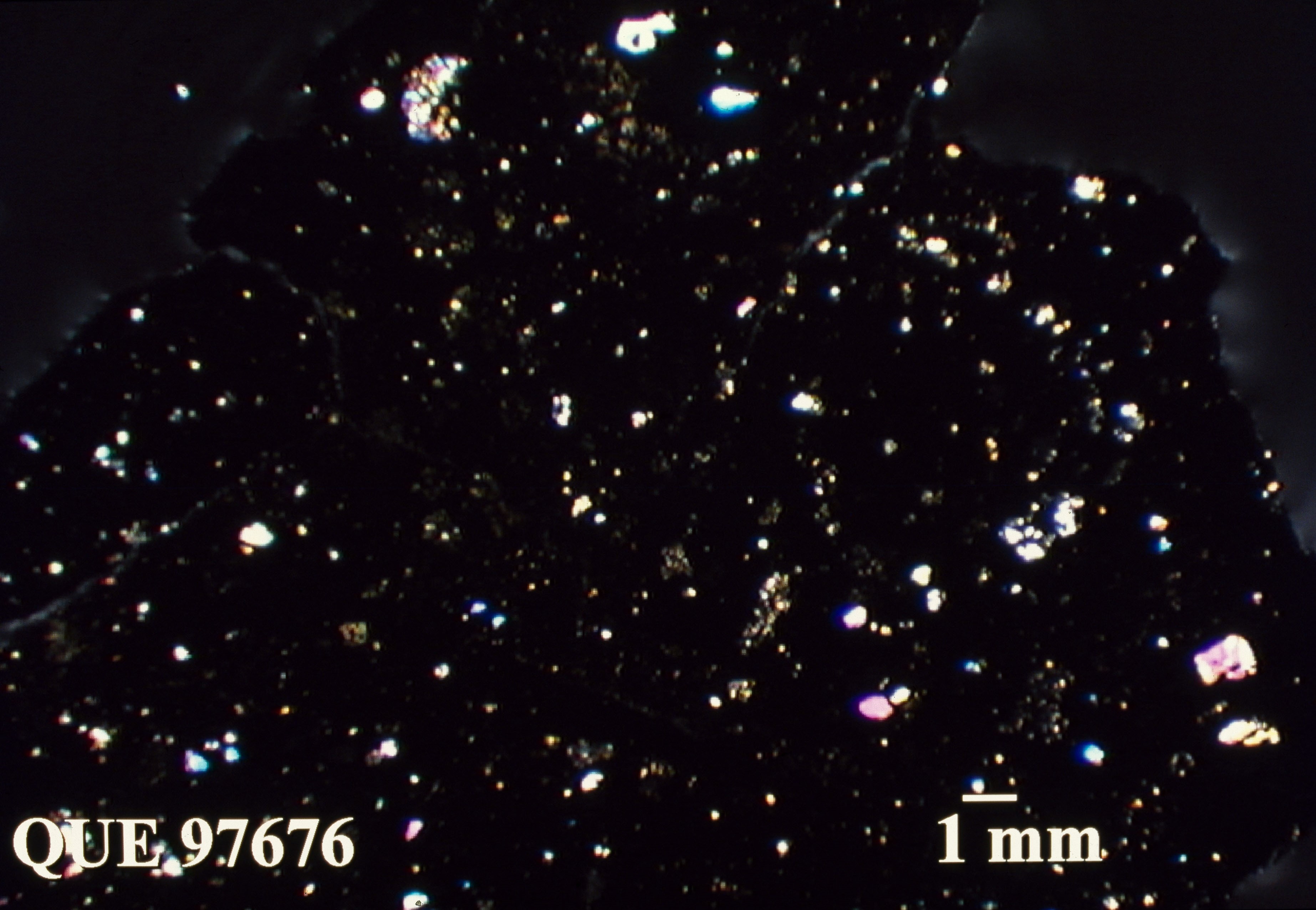 Thin Section Photo of Sample QUE 97676 in Cross-Polarized Light with 1.25X Magnification