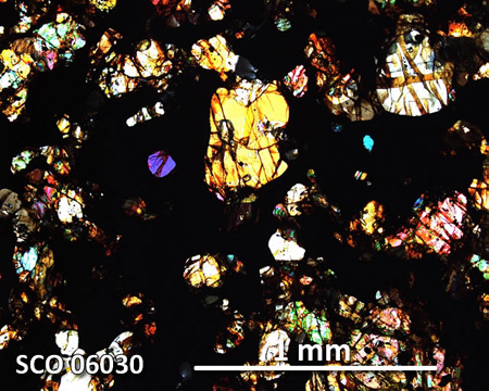 SCO 06030 Meteorite Thin Section Photo with 5x magnification in Cross-Polarized Light