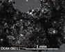 DOM 08011 Meteorite Thin Section Photo with 5x magnification in Cross-Polarized Light