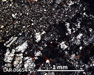 LAR 06654 Meteorite Thin Section Photo with 5x magnification in Cross-Polarized Light