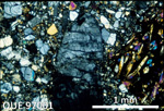 Thin Section Photo of Sample QUE 97001 in Cross-Polarized Light with 2.5X Magnification