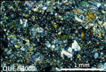 Thin Section Photo of Sample QUE 97004 in Cross-Polarized Light with 2.5X Magnification