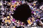 Thin Section Photo of Sample QUE 97080 in Cross-Polarized Light with 2.5X Magnification