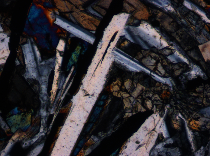 Thin Section Photograph of Apollo 12 Sample 12055,7 in Cross-Polarized Light at 10x Magnification and 0.7 mm Field of View (View #5)