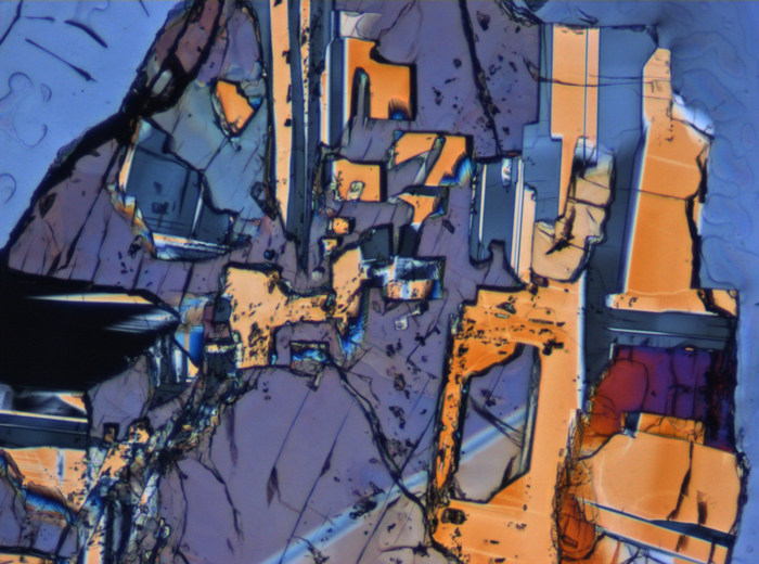Thin Section Photograph of Apollo 15 Sample 15075,42 in Cross-Polarized Light at 10x Magnification and 0.7 mm Field of View (View #5)