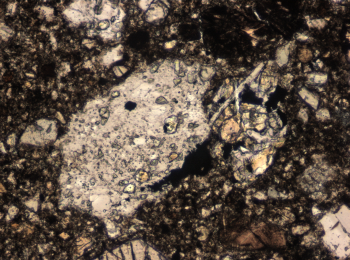 Thin Section Photograph of Apollo 15 Sample 15298,5 in Plane-Polarized Light at 10x Magnification and 0.7 mm Field of View (View #4)