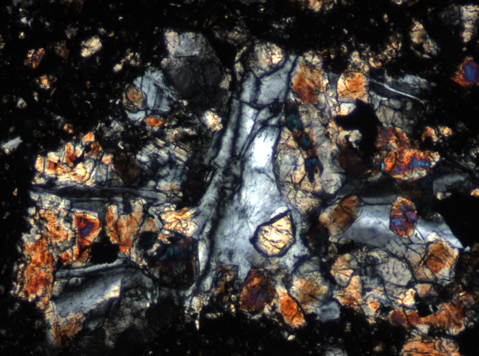 Thin Section Photograph of Apollo 15 Sample 15505,53 in Cross-Polarized Light at 10x Magnification and 0.7 mm Field of View (View #4)