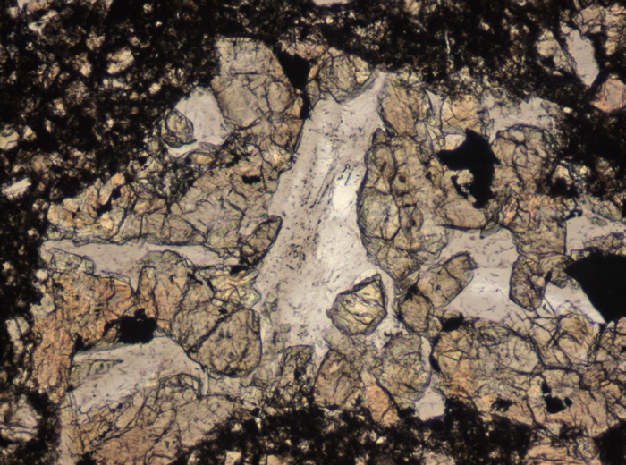 Thin Section Photograph of Apollo 15 Sample 15505,53 in Plane-Polarized Light at 10x Magnification and 0.7 mm Field of View (View #4)