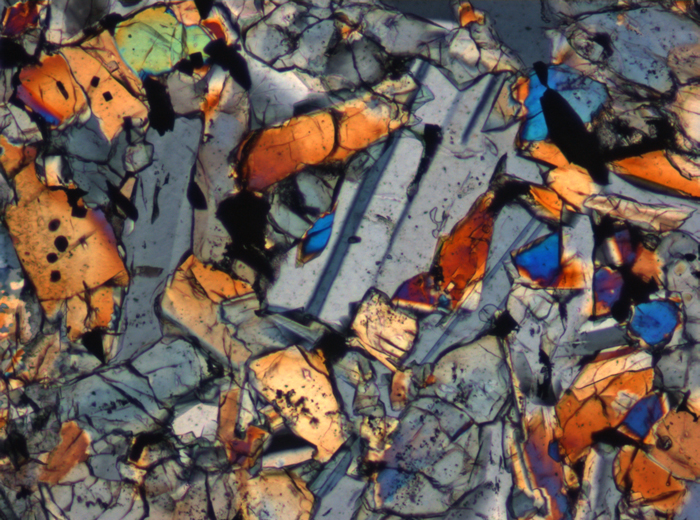 Thin Section Photograph of Apollo 15 Sample 15665,13 in Cross-Polarized Light at 10x Magnification and 0.7 mm Field of View (View #5)