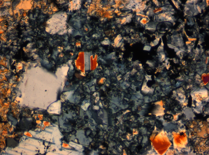 Thin Section Photograph of Apollo 16 Sample 65015,164 in Cross-Polarized Light at 2.5x Magnification and 2.85 mm Field of View (View #23)