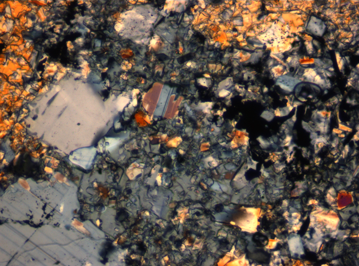 Thin Section Photograph of Apollo 16 Sample 65015,164 in Cross-Polarized Light at 2.5x Magnification and 2.85 mm Field of View (View #27)