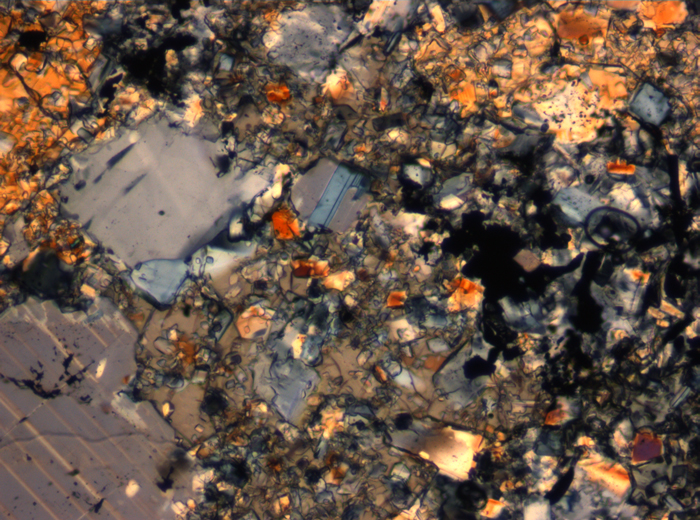 Thin Section Photograph of Apollo 16 Sample 65015,164 in Cross-Polarized Light at 2.5x Magnification and 2.85 mm Field of View (View #29)