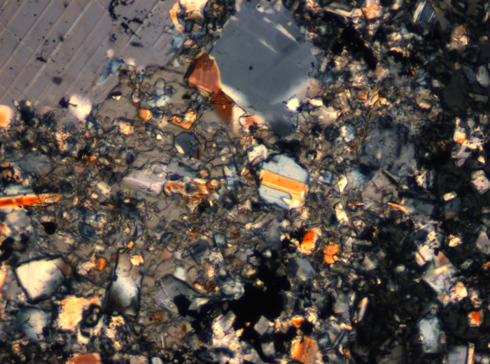 Thin Section Photograph of Apollo 16 Sample 65015,164 in Cross-Polarized Light at 2.5x Magnification and 2.85 mm Field of View (View #45)
