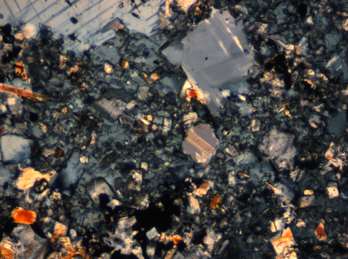 Thin Section Photograph of Apollo 16 Sample 65015,164 in Cross-Polarized Light at 2.5x Magnification and 2.85 mm Field of View (View #49)