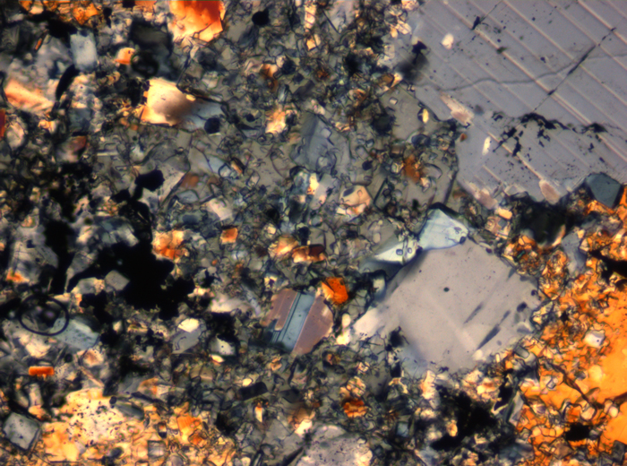 Thin Section Photograph of Apollo 16 Sample 65015,164 in Cross-Polarized Light at 2.5x Magnification and 2.85 mm Field of View (View #64)