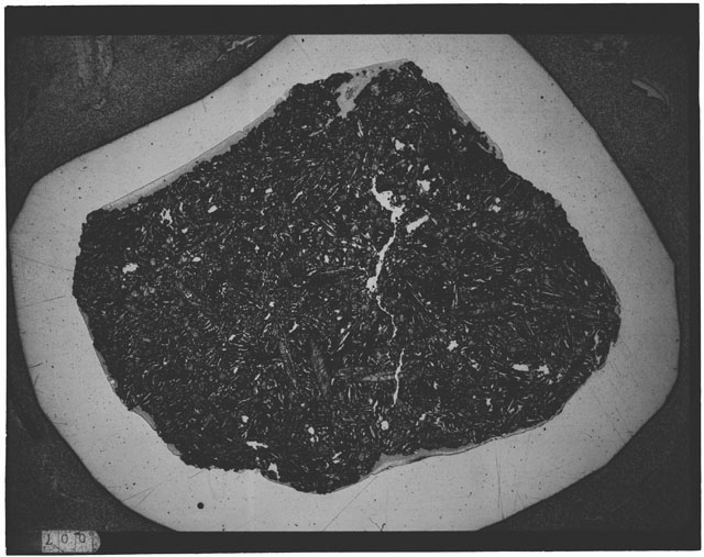 Black and white Thin Section photograph of Apollo 12 Sample(s) 12065,8 using cross nichols light.