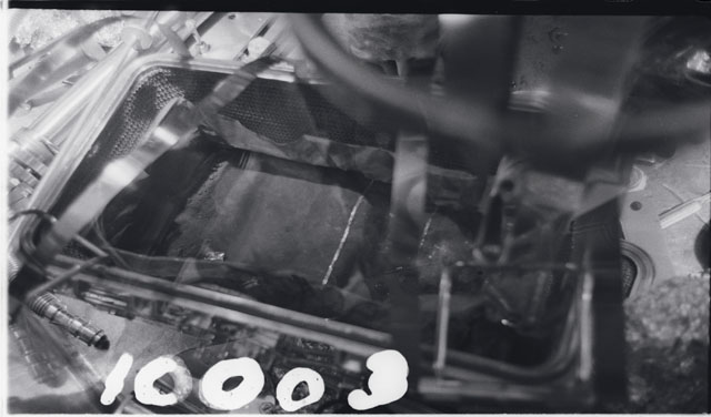 Black and white photograph of Apollo 11 Sample(s) 10003; Processing photograph displaying a sample in rock box.