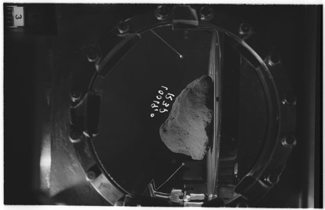 Black and white photograph of apollo 11 Sample(s) 10019,0; Processing photograph displaying sample in vacuum vault at R3P.