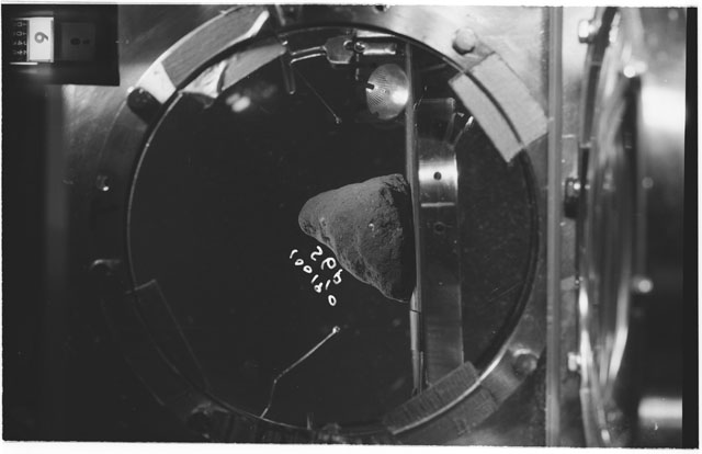 Black and white photograph of apollo 11 Sample(s) 10019,0; Processing photograph displaying sample in vacuum vault at S6P.