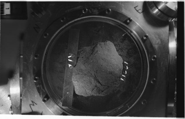 Black and white photograph of Apollo 11 Sample(s) 10017,0; Processing photograph in vacuum vault at R1P with an orientation of T.