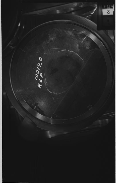 Black and white photograph of apollo 11 Sample(s) 10019,0; Processing photograph displaying sample in vacuum vault at R2P .