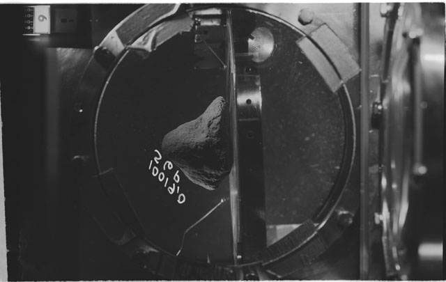 Black and white photograph of apollo 11 Sample(s) 10019,0; Processing photograph displaying sample in vacuum vault at S6P.