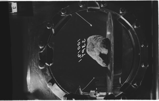 Black and white photograph of apollo 11 Sample(s) 10019,1; Processing photograph displaying sample in vacuum vault at S3PT.