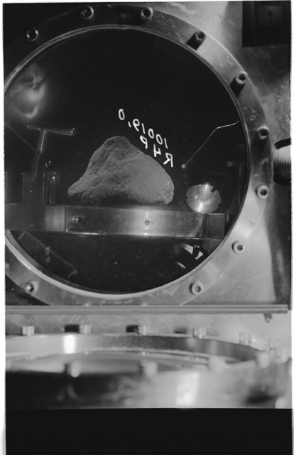 Black and white photograph of apollo 11 Sample(s) 10019,0; Processing photograph displaying sample in vacuum vault at R4P.