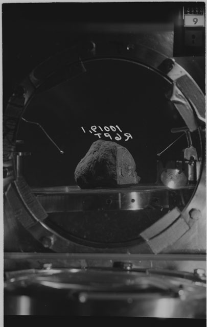 Black and white photograph of apollo 11 Sample(s) 10019,1; Processing photograph displaying sample in vacuum vault at R6PT.