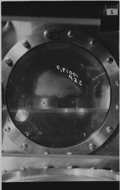 Black and white photograph of apollo 11 Sample(s) 10019,0; Processing photograph displaying sample in vacuum vault at S5P .